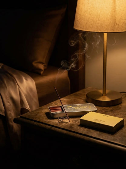 Incense sticks in Provence Butter burning in dark minimalist bedroom